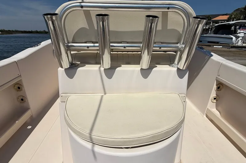 Slide: The Image of 2011 Grady-White Fisherman 209 boat interior with rod holders and seating. - 25