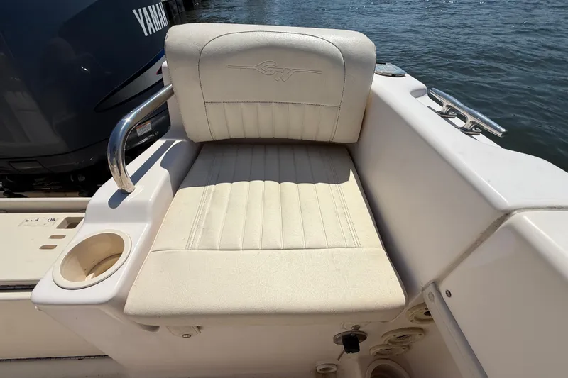 Slide: The Image of 2011 Grady-White Fisherman 209 boat seat with cup holder, near water. - 32