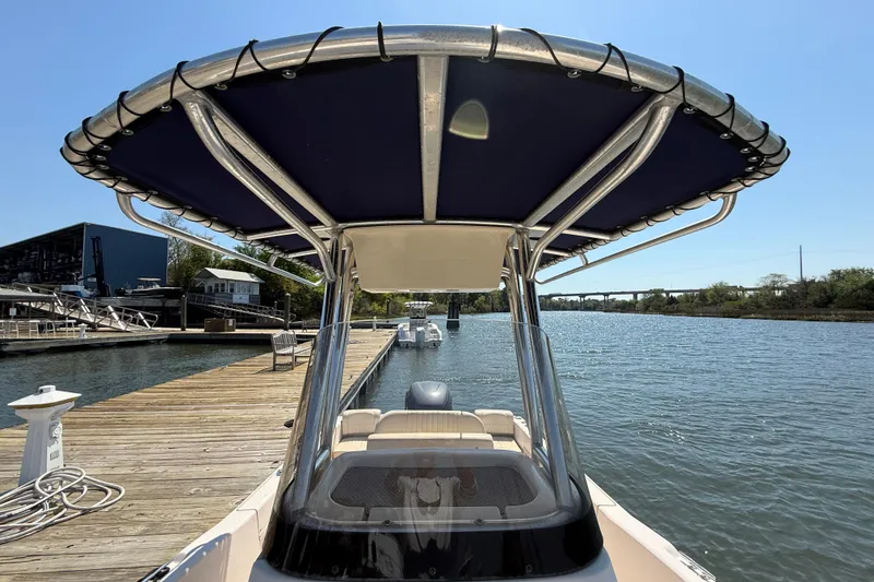 Slide: The Image of 2011 Grady-White Fisherman 209 boat docked by a serene waterfront. - 33