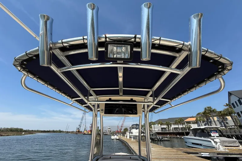 Slide: The Image of 2011 Grady-White Fisherman 209 boat with T-top and rod holders at marina. - 34