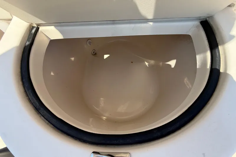 Slide: The Image of Open storage compartment on 2011 Grady-White Fisherman 209 boat. - 35