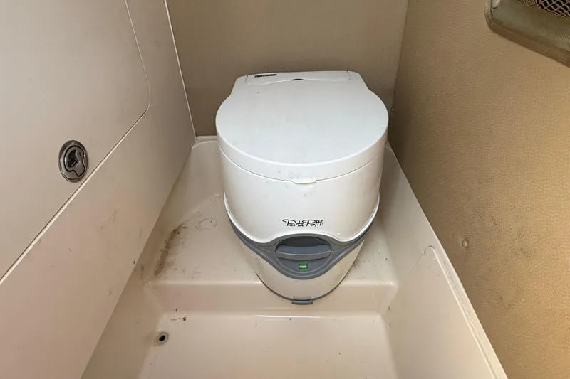 Slide: The Image of Portable toilet in 2011 Grady-White Fisherman 209 boat interior. - 36