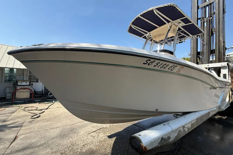 Slide: The Image of 2011 Grady-White Fisherman 209 boat with T-top on a lift, side view. - 9