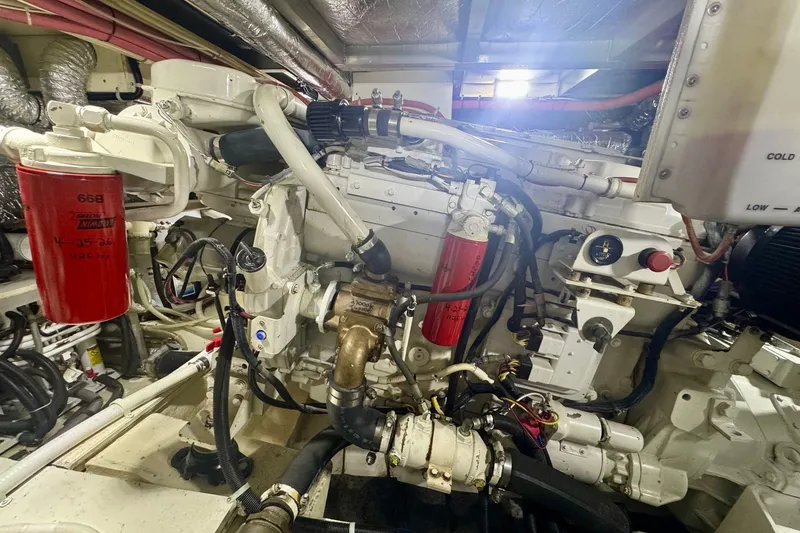 Slide: The Image of Engine room of 2000 Navigator 6300 Classic Pilothouse with visible machinery and components. - 65