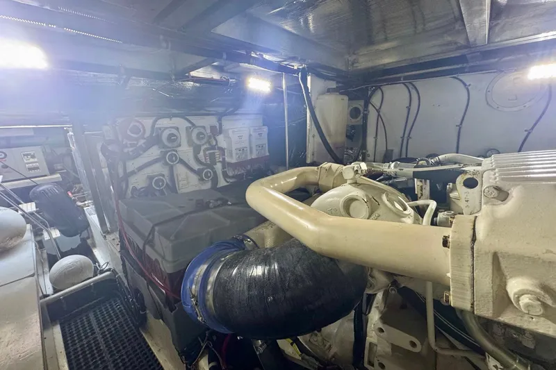 Slide: The Image of Engine room of a 2000 Navigator 6300 Classic Pilothouse yacht, showcasing machinery and components. - 60