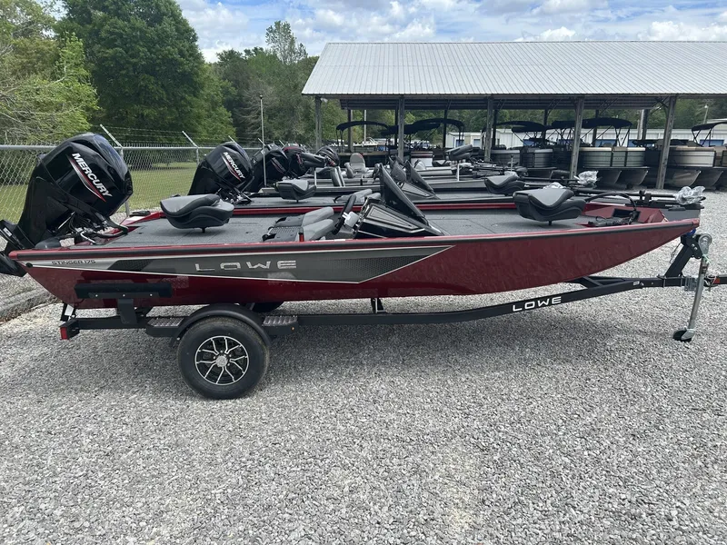 The Image of 2026 Lowe Stinger ST175 boat on trailer, parked outdoors. - 1