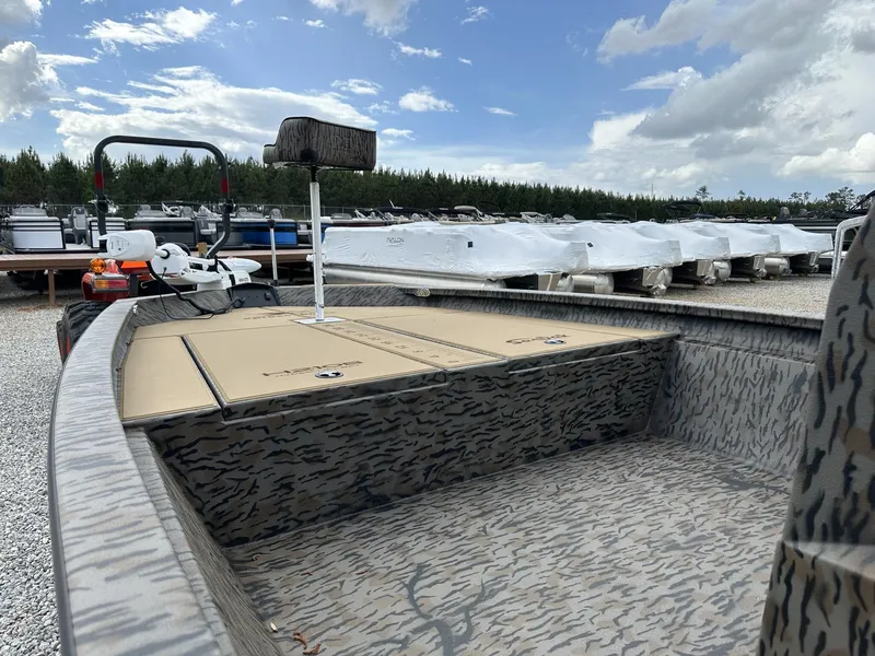 Slide: The Image of 2026 Xpress Hyper-Lift Bay Series H210B boat outdoors. - 5