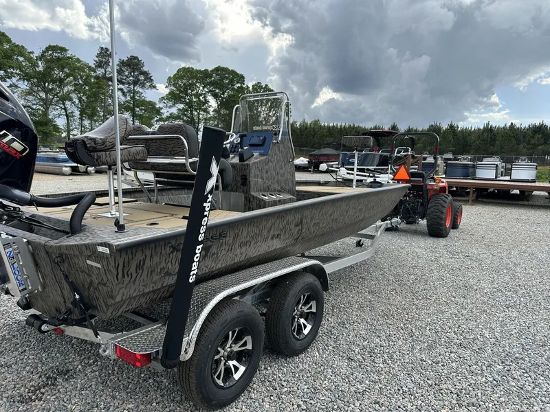 Slide: The Image of Xpress Hyper-Lift Bay Series H210B boat on trailer, 2026 model. - 7