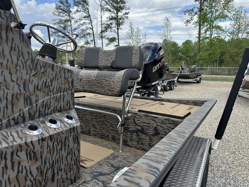 Slide: The Image of 2026 Xpress Hyper-Lift Bay Series H210B boat with camouflage design. - 9