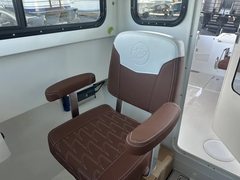 Slide: The Image of 2026 Parker 227 Explorer boat seat with logo. - 12