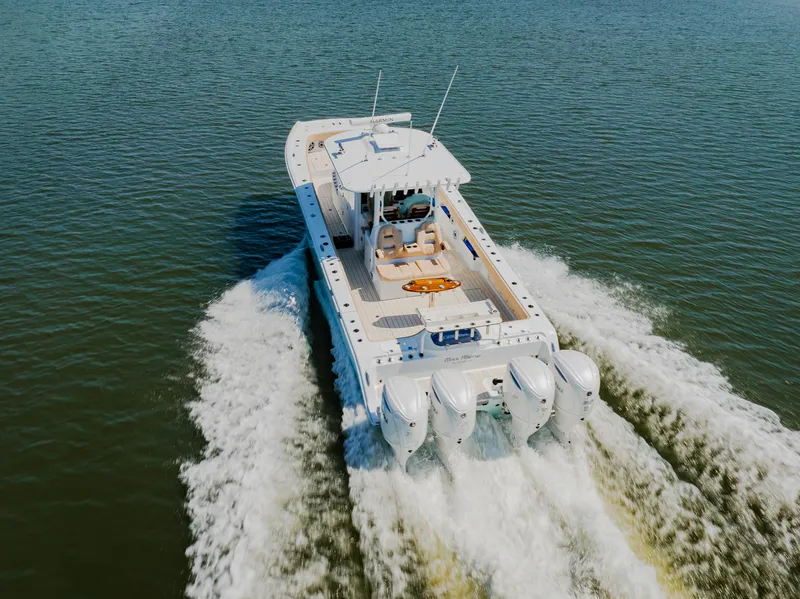 Slide: The Image of Freeman 38 boat cruising on water, 2025 model, aerial view. - 13