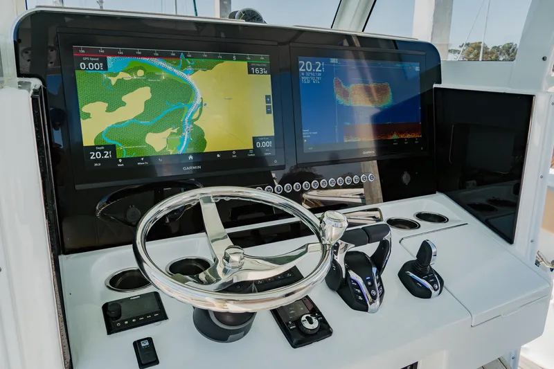 Slide: The Image of Helm of 2025 Freeman 38 boat with advanced navigation displays and controls. - 22