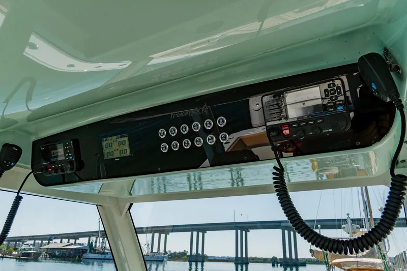 Slide: The Image of Interior view of Freeman 38 boat dashboard, featuring modern controls and communication equipment, 2025 model. - 25