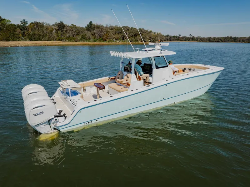 Slide: The Image of Freeman 38 boat, 2025 model, cruising on calm water with twin Yamaha engines. - 3