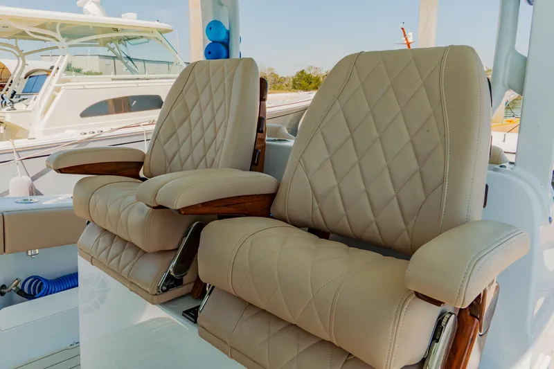 Slide: The Image of Luxurious seating on a 2025 Freeman 38 boat with diamond-stitched upholstery. - 32