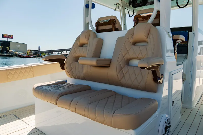 Slide: The Image of Luxurious seating on a 2025 Freeman 38 boat, featuring tan leather upholstery and modern design. - 33