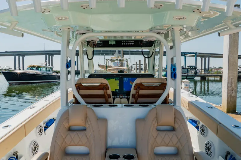 Slide: The Image of Interior view of a 2025 Freeman 38 boat docked at a marina. - 34