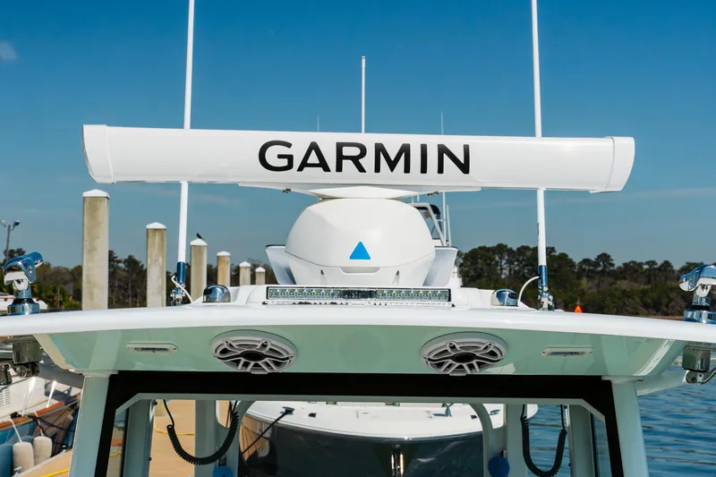 Slide: The Image of Freeman 38 boat with Garmin radar, docked, clear sky, 2025 model. - 40