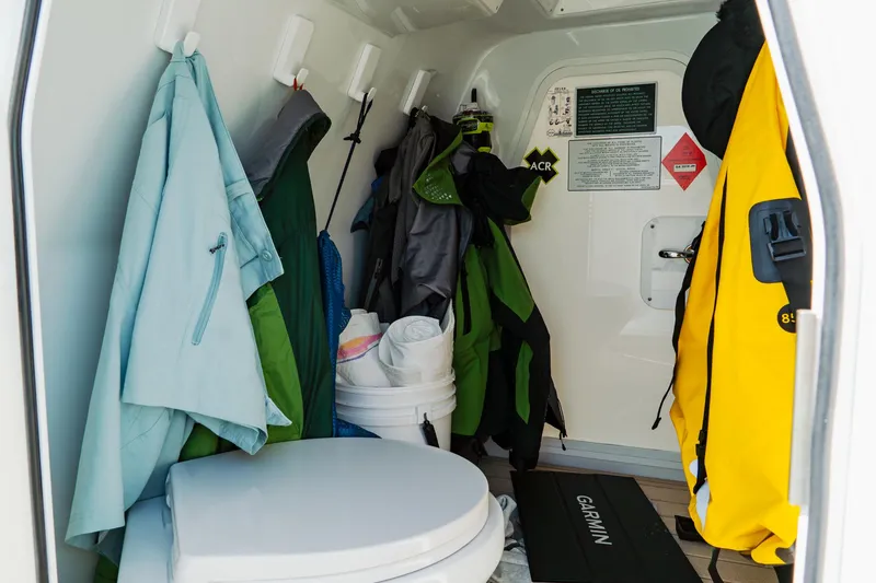 Slide: The Image of Interior of Freeman 38 boat cabin with jackets and toilet, 2025 model. - 43