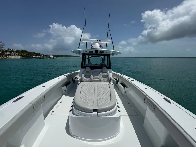 Slide: The Image of 2025 Freeman 38 boat on calm water under a partly cloudy sky. - 17