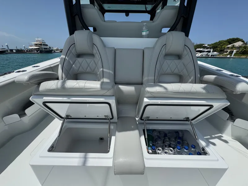 Slide: The Image of Luxury seating with storage on a 2025 Freeman 38 boat, featuring built-in coolers. - 31