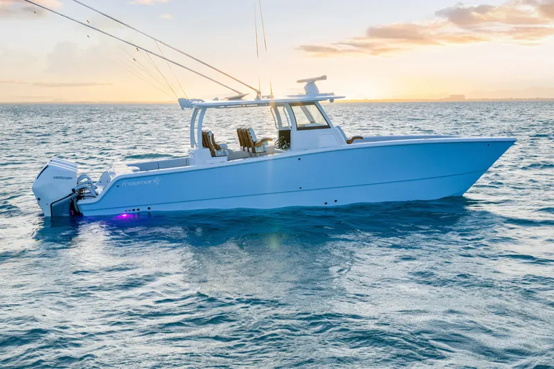 Slide: The Image of 2026 Freeman 38 boat on ocean at sunset with Mercury engines. - 41