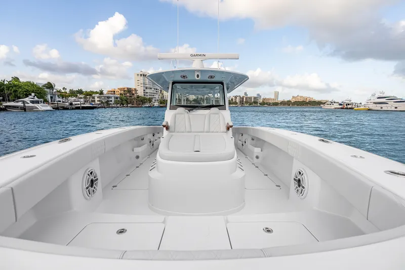 Slide: The Image of 2026 Freeman 38 boat on water, showcasing spacious deck and modern design. - 55