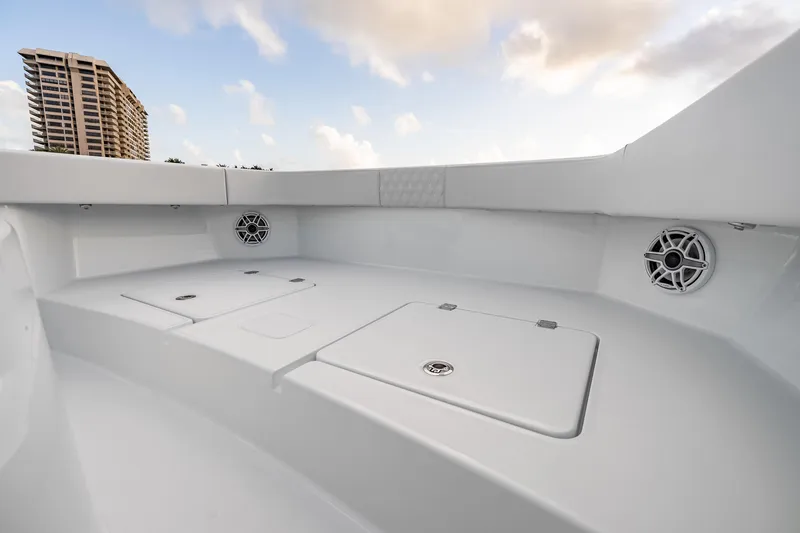 Slide: The Image of Interior view of 2026 Freeman 38 boat with sleek white design and built-in speakers. - 63