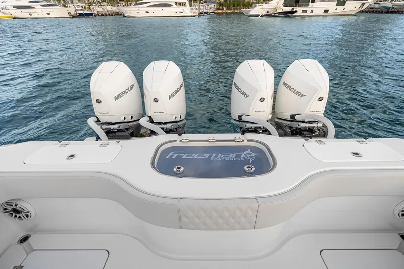 Slide: The Image of Freeman 38 boat with four Mercury outboard engines on water, 2026 model. - 65