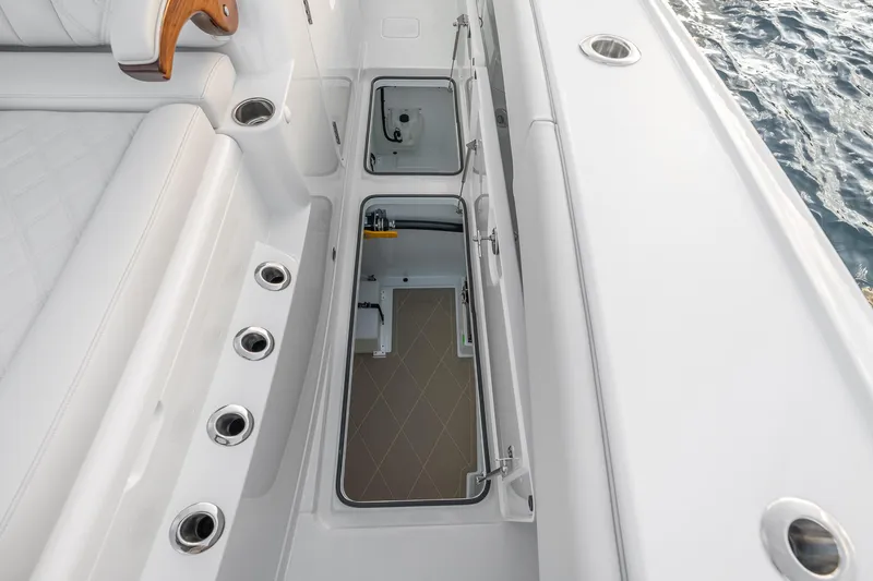 Slide: The Image of Interior view of a 2026 Freeman 38 boat, showcasing storage compartments and seating. - 68