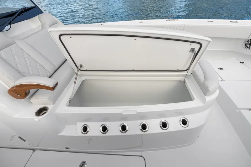 Slide: The Image of Open storage compartment on a 2026 Freeman 38 boat, featuring sleek white design. - 70