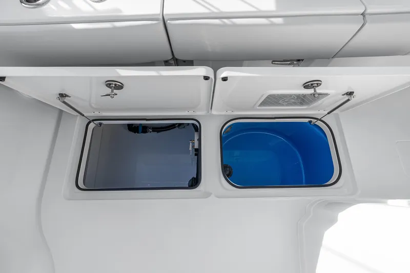 Slide: The Image of Open storage compartments on a 2026 Freeman 38 boat, showcasing interior design. - 73