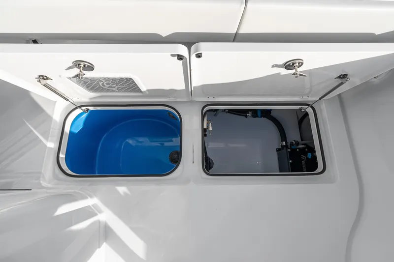 Slide: The Image of Freeman 38 (2026) boat storage compartments with open hatches, showcasing interior details. - 74