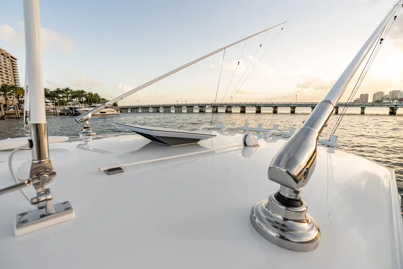 Slide: The Image of Rooftop view of Freeman 38 boat, 2026 model, with fishing rods and scenic waterfront. - 78