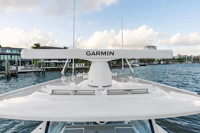Slide: The Image of 2026 Freeman 38 boat with Garmin radar on calm waterfront. - 82
