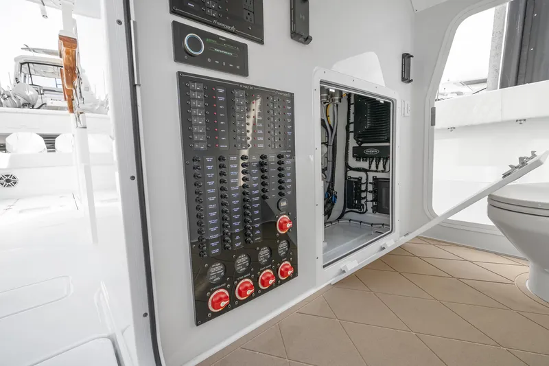 Slide: The Image of Electrical panel and wiring inside a 2026 Freeman 38 boat, showcasing modern marine technology. - 84