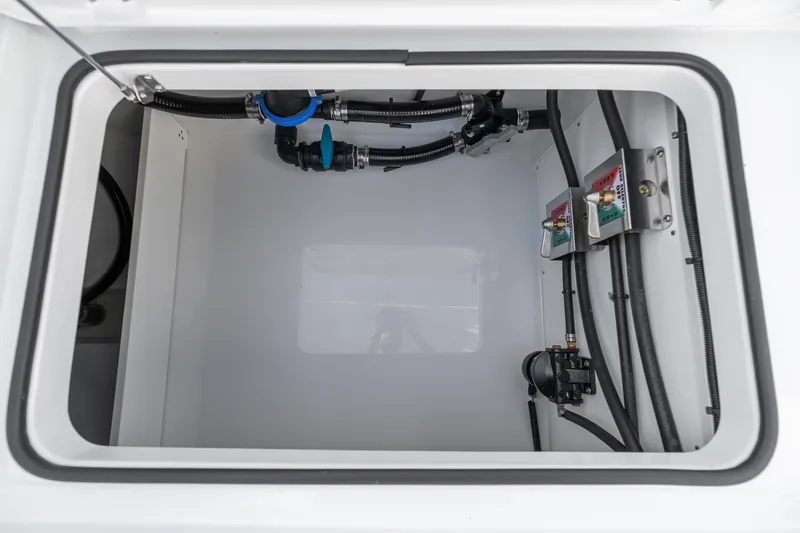 Slide: The Image of Interior view of a 2026 Freeman 38 boat compartment with plumbing and wiring. - 87