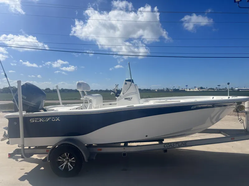 Slide: The Image of 2013 Sea Fox 180XT boat on trailer under blue sky. - 7