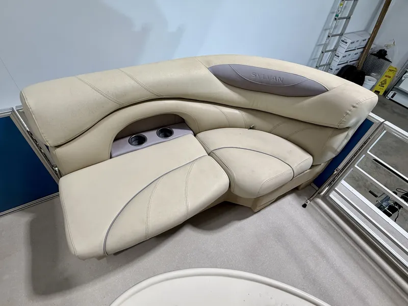 Slide: The Image of Beige seating on a 2017 Sylvan 8520 boat with cup holders. - 17