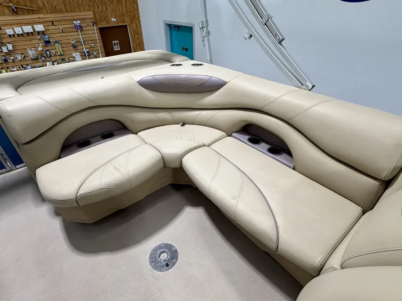 Slide: The Image of Interior of a 2017 Sylvan 8520 pontoon boat with beige seating. - 18