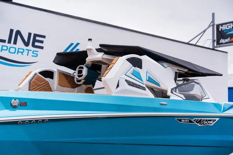 Slide: The Image of 2026 Tigé Ultré 25ZX boat with sleek design and blue finish. - 10
