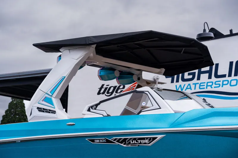 Slide: The Image of 2026 Tigé Ultré 25ZX boat with sleek design and blue finish. - 11