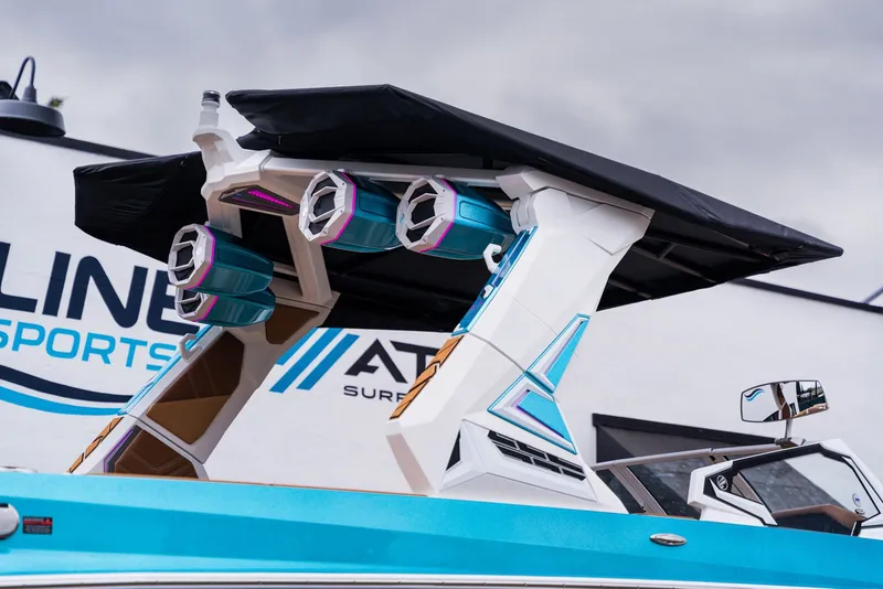 Slide: The Image of 2026 Tigé Ultré 25ZX boat with modern speakers and design. - 12