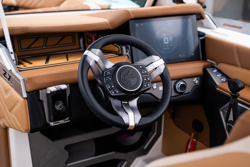 Slide: The Image of Interior of 2026 Tigé Ultré 25ZX with modern steering wheel and display. - 25