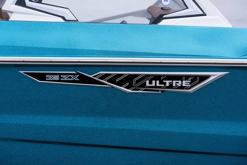 Slide: The Image of Close-up of 2026 Tigé Ultré 25ZX boat logo. - 34