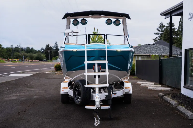 Slide: The Image of 2026 Tigé Ultré 25ZX boat on trailer, front view. - 7