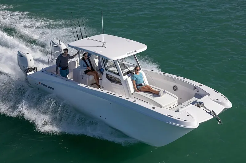 Slide: The Image of Manufacturer Provided Image: 2026 Twin Vee 280 GFX2 CC cruising on open water with passengers enjoying the ride. - 6