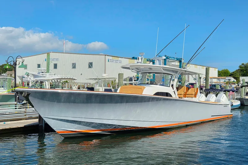 Slide: The Image of 2023 Valhalla Boatworks V-46 docked, showcasing sleek design and modern features. - 13