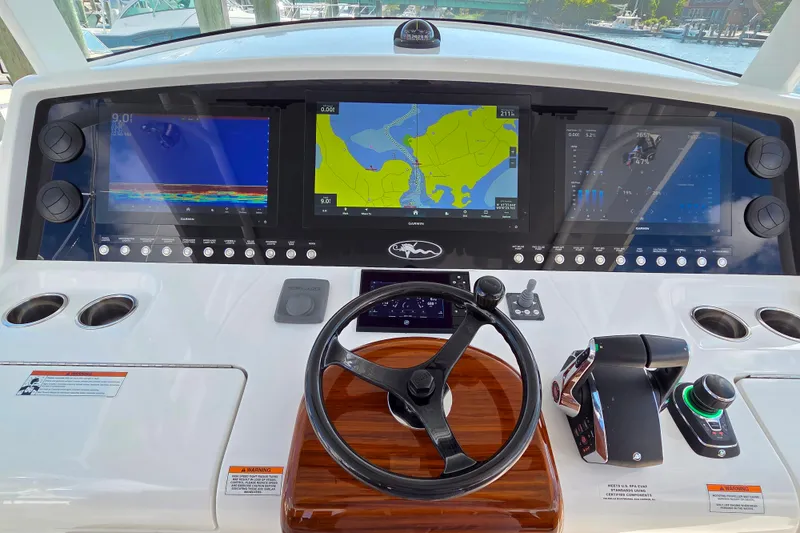 Slide: The Image of 2023 Valhalla Boatworks V-46 helm with advanced navigation displays and controls. - 20