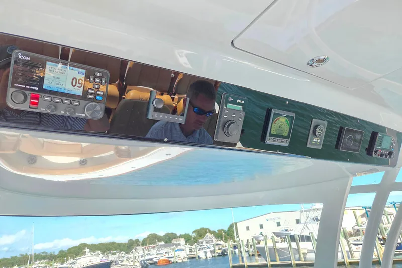 Slide: The Image of 2023 Valhalla Boatworks V-46 dashboard with advanced navigation and communication equipment. - 22